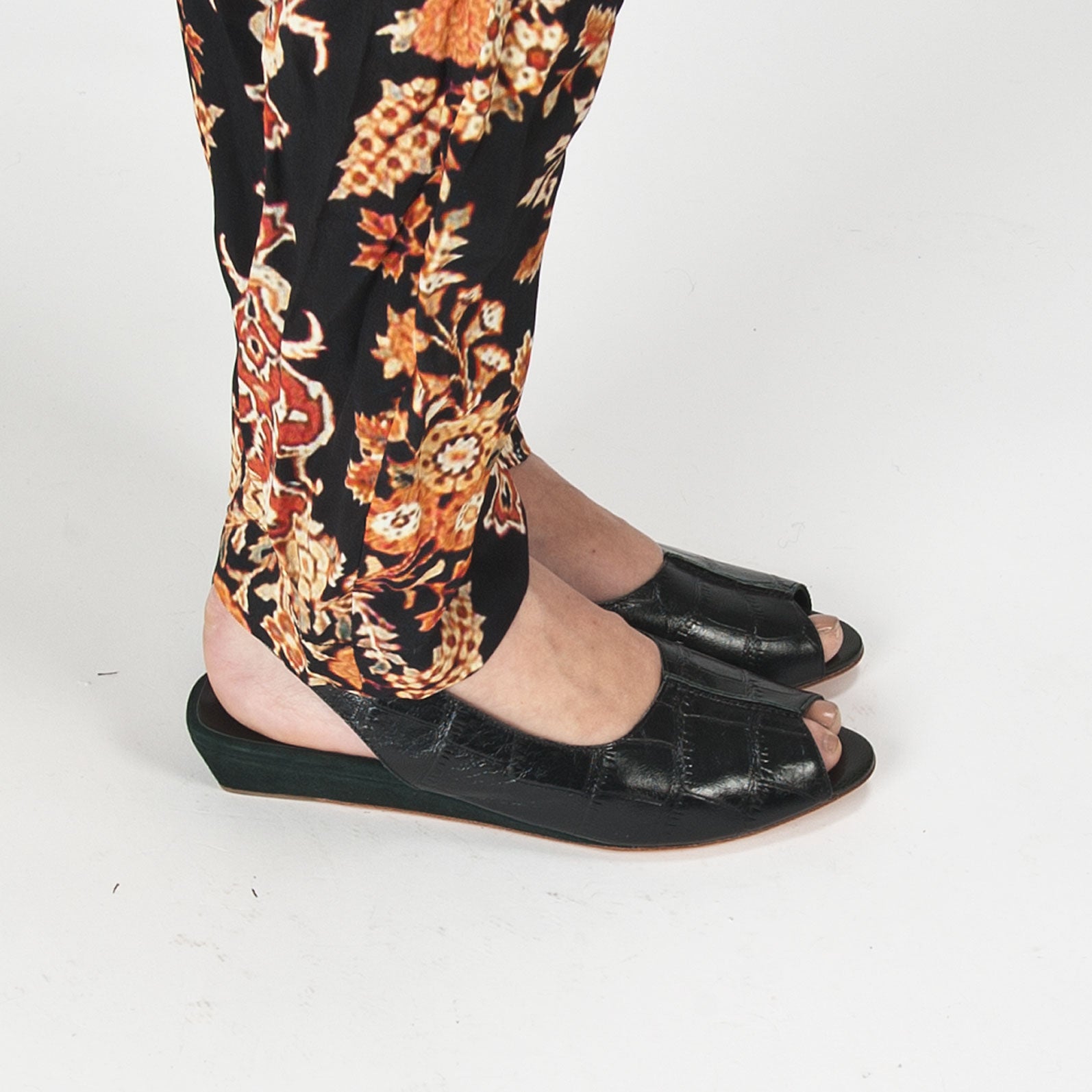 K414 leather slingbacks; black croc