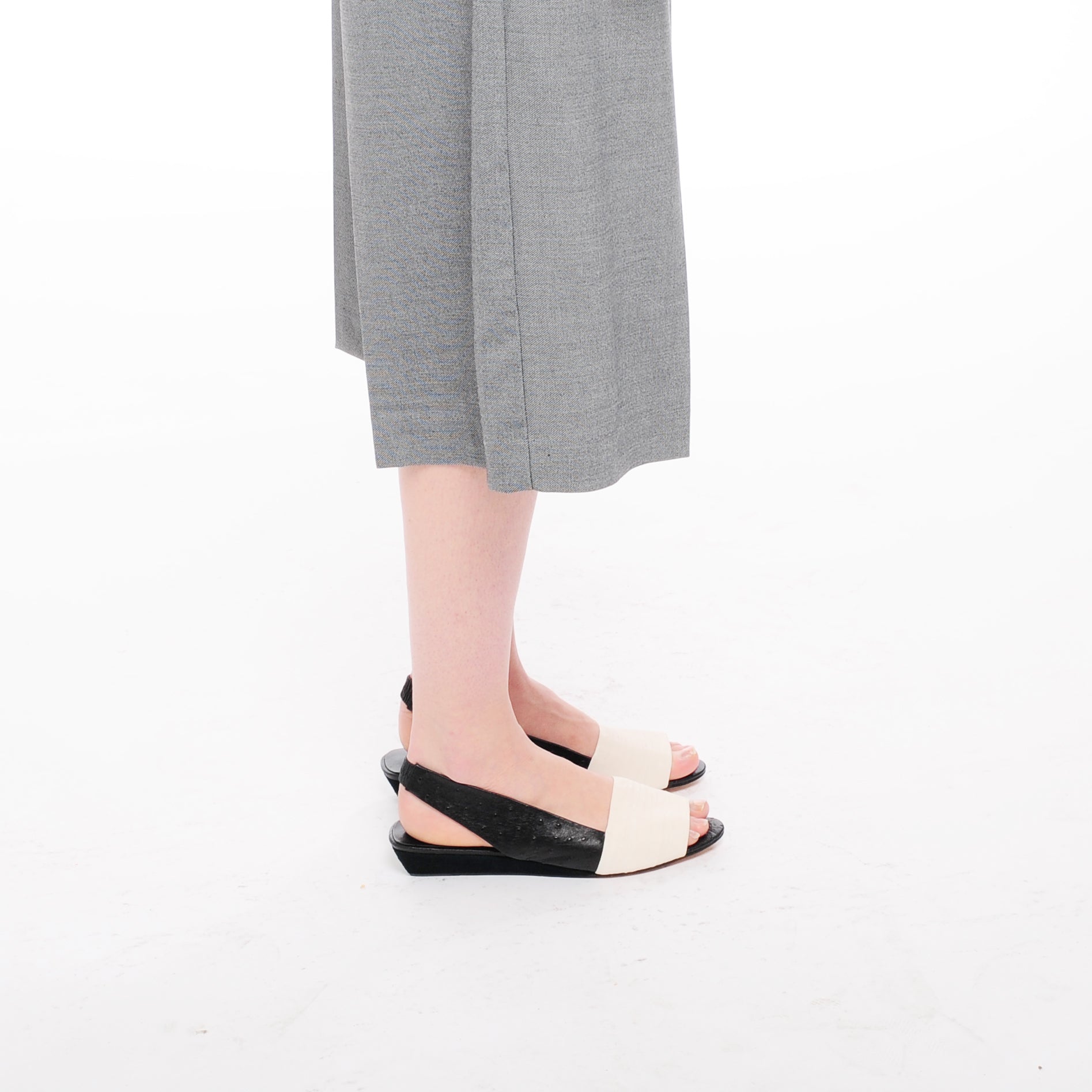 K432 leather slingbacks; white and black ostrich