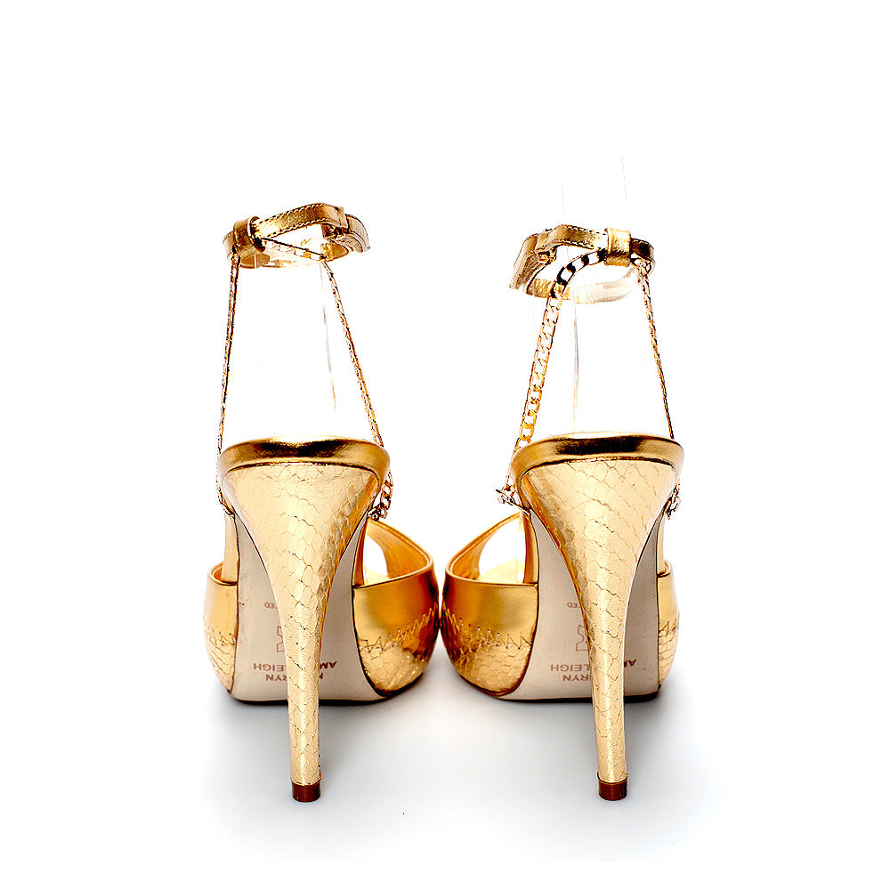 3083 snake skin heels; gold