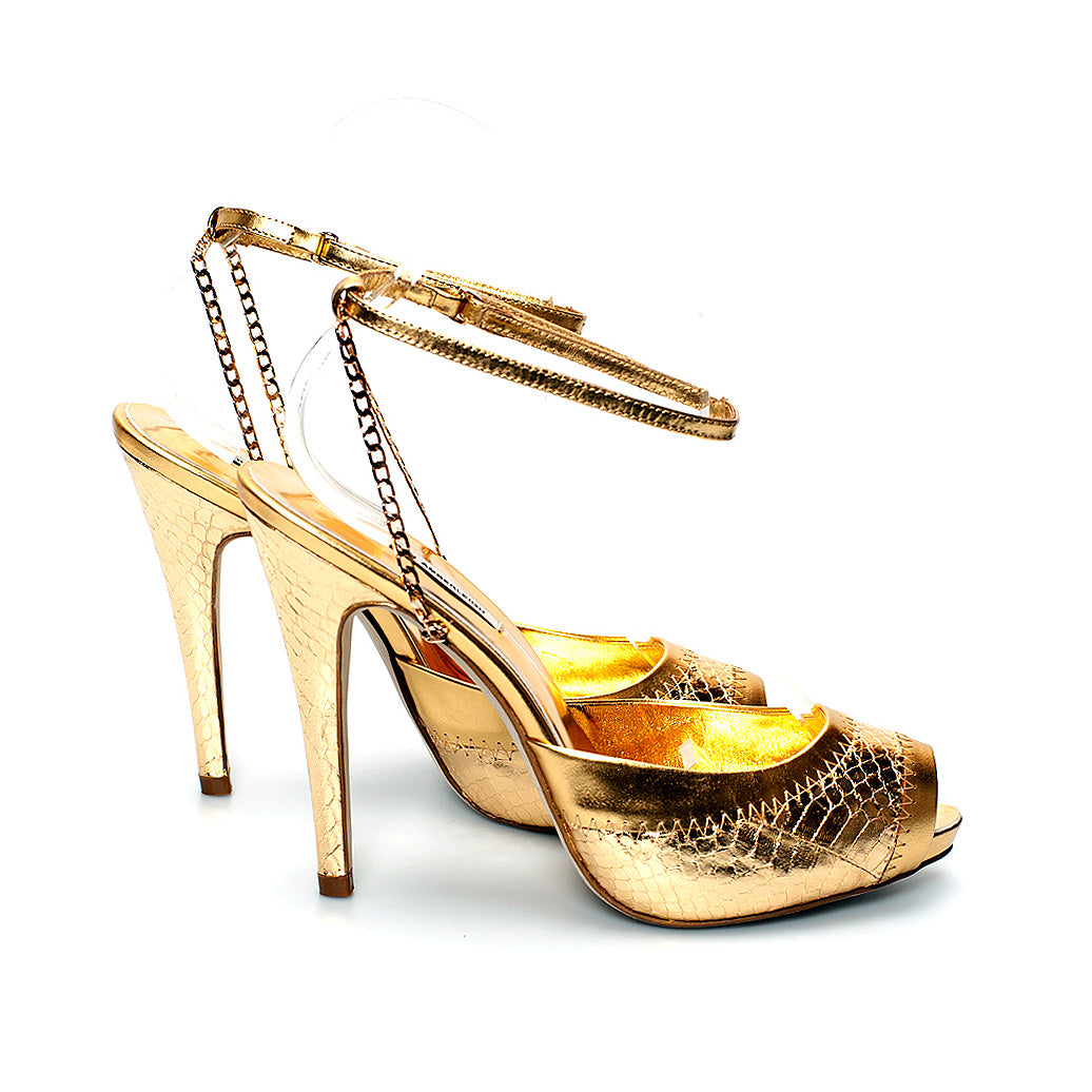 3083 snake skin heels; gold