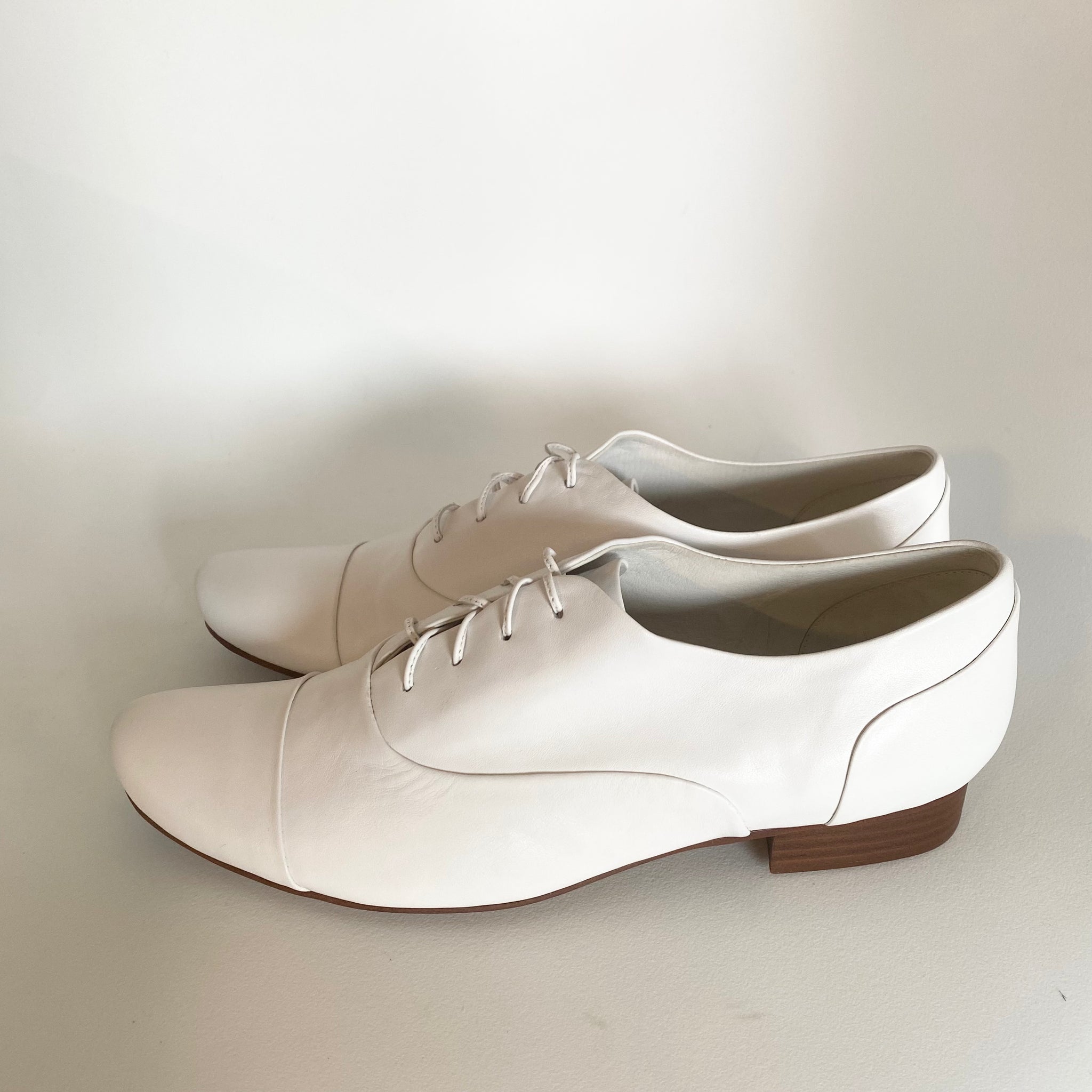 J544 leather loafers; white