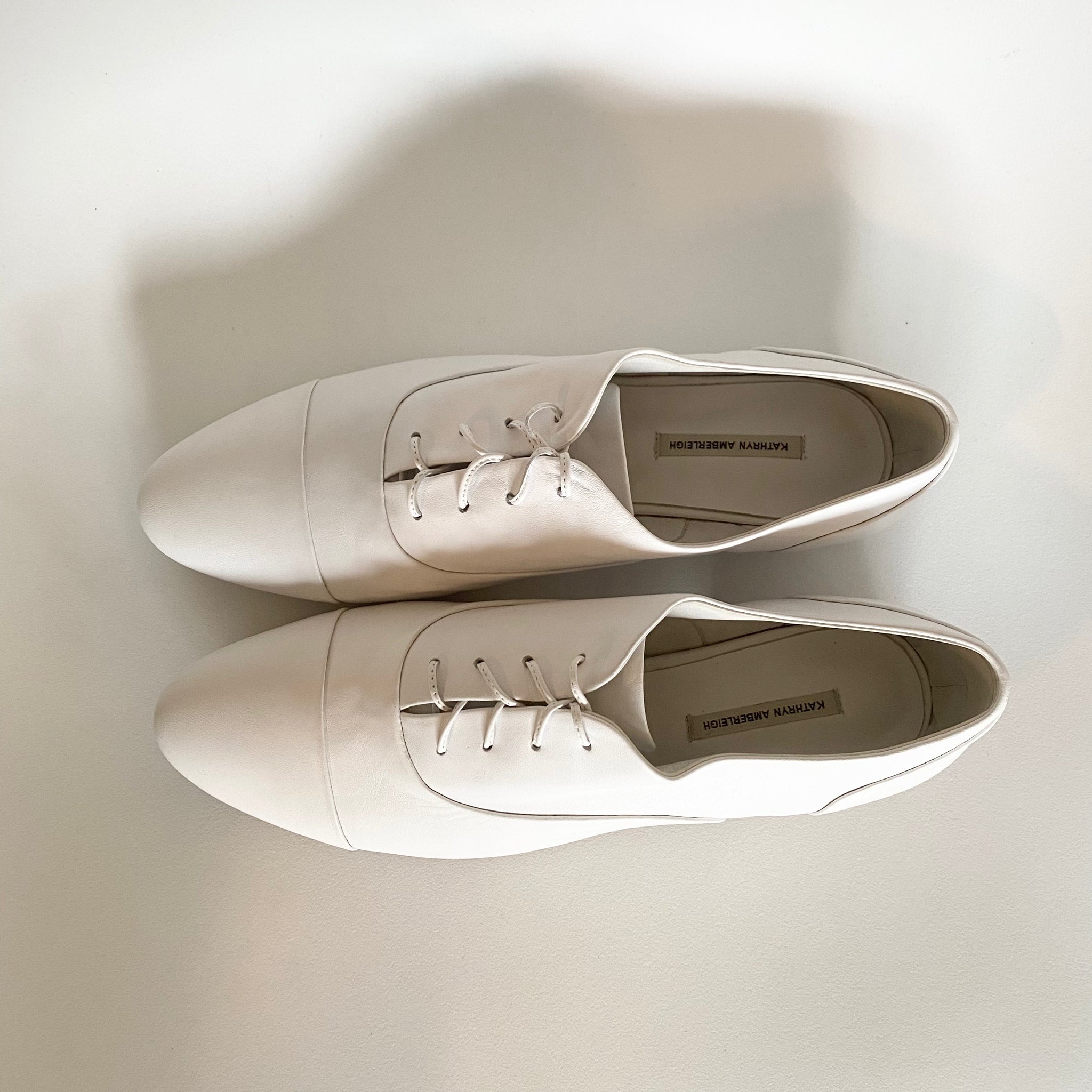 J544 leather loafers; white