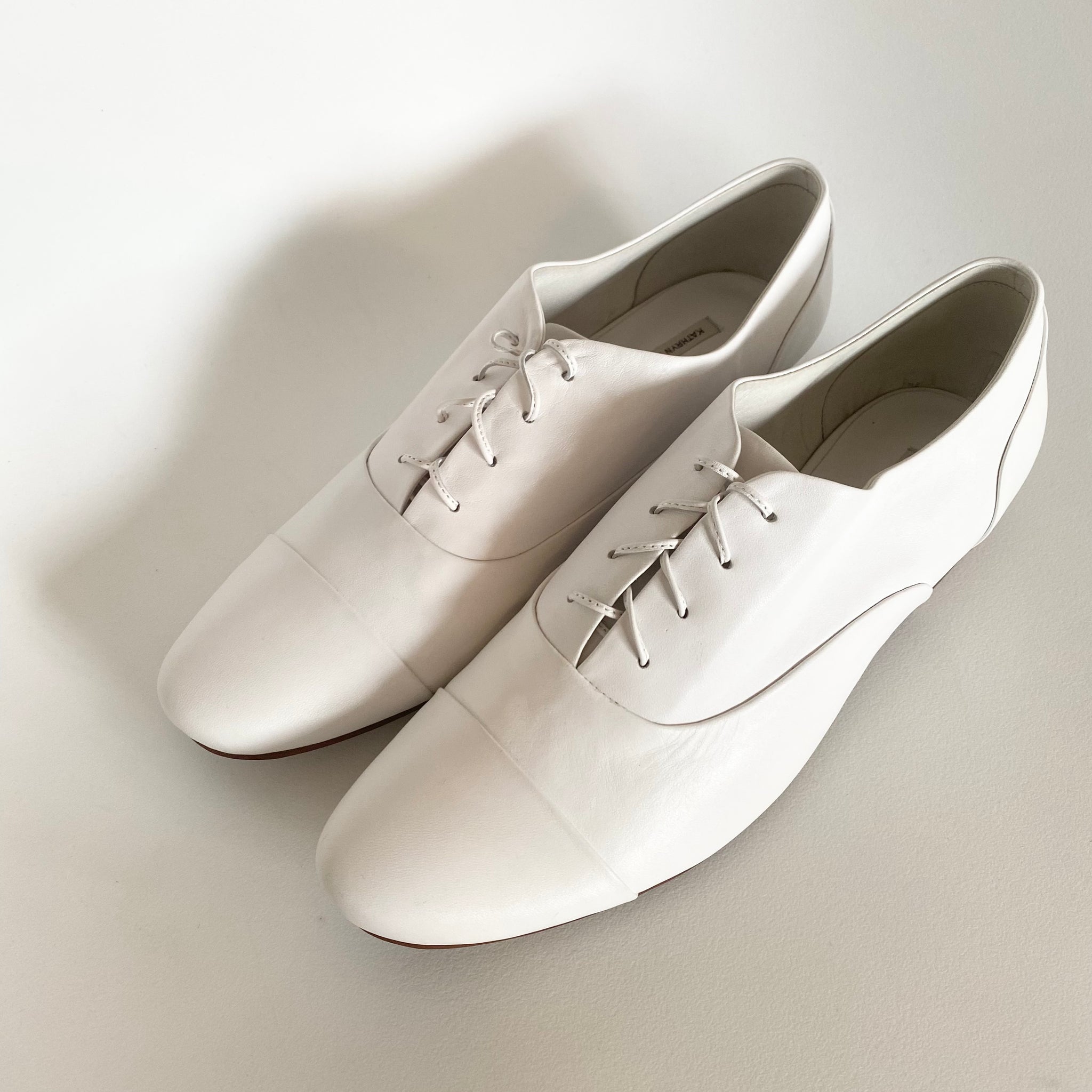 J544 leather loafers; white