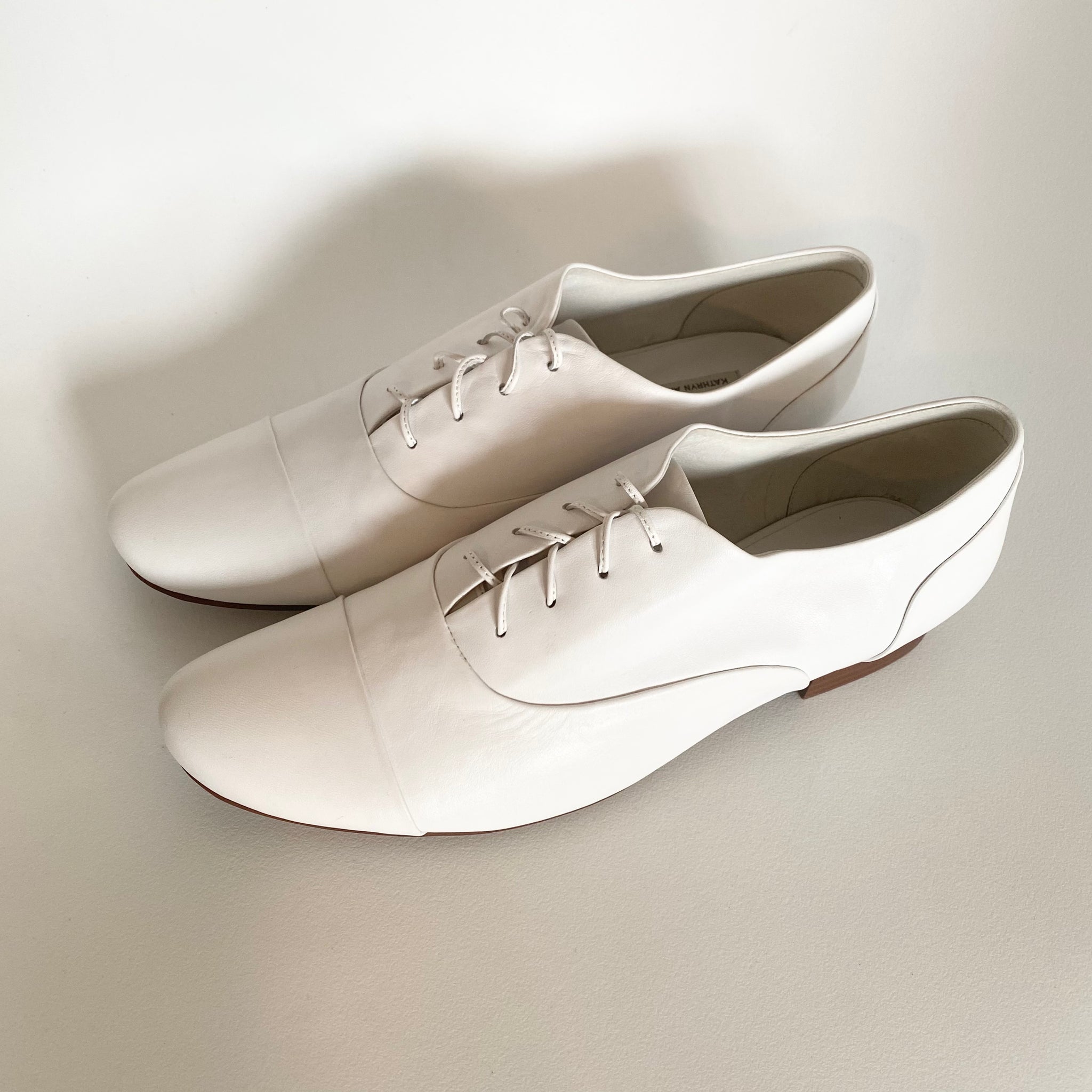 J544 leather loafers; white