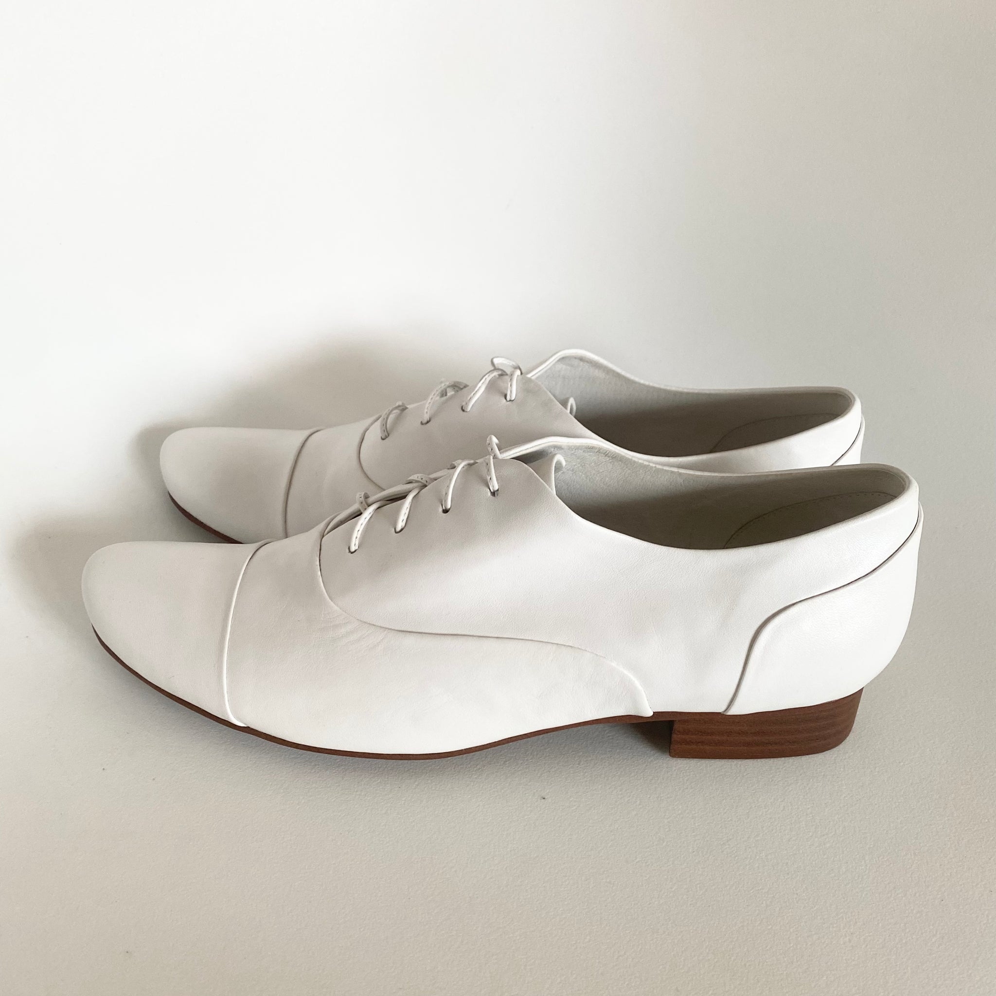 J544 leather loafers; white