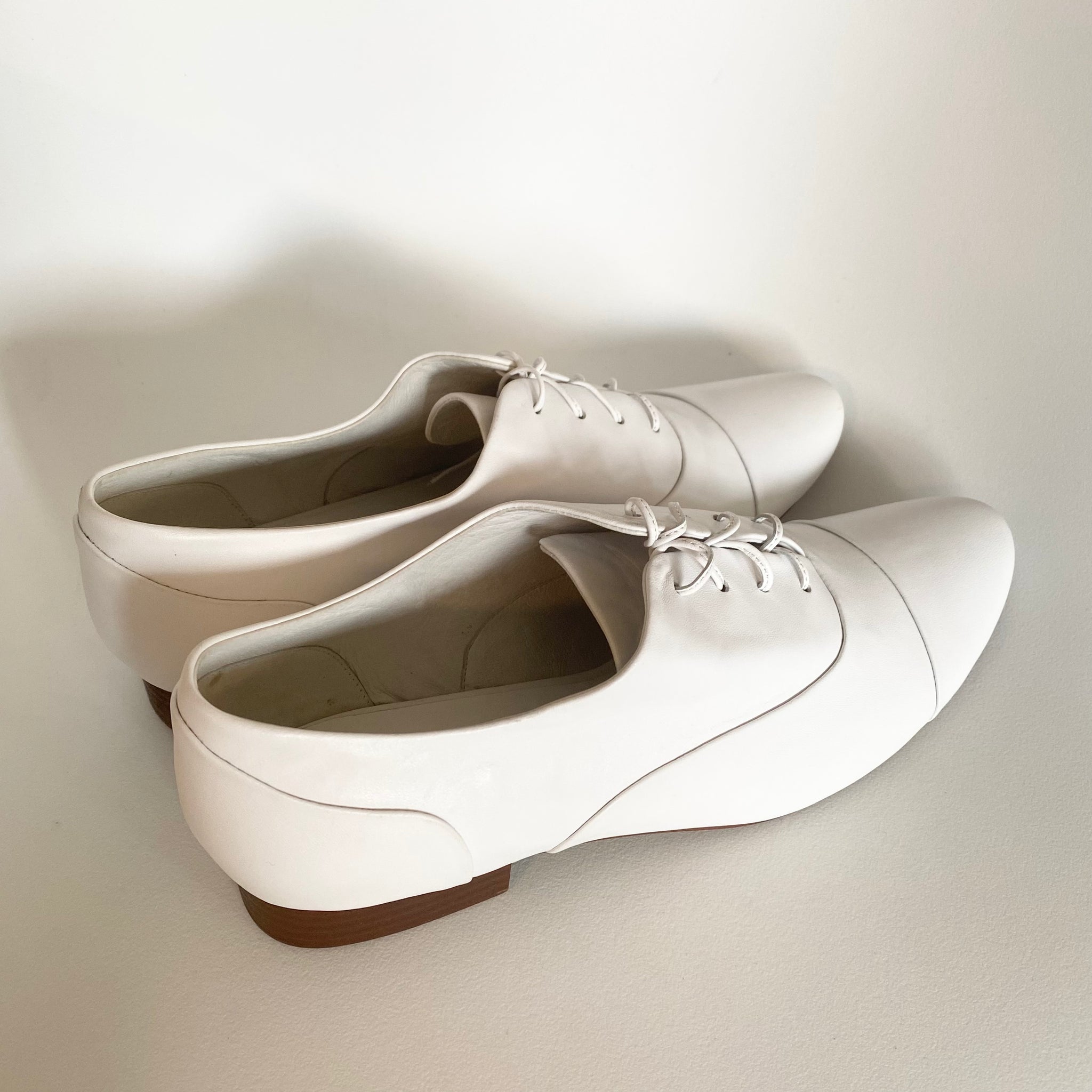 J544 leather loafers; white