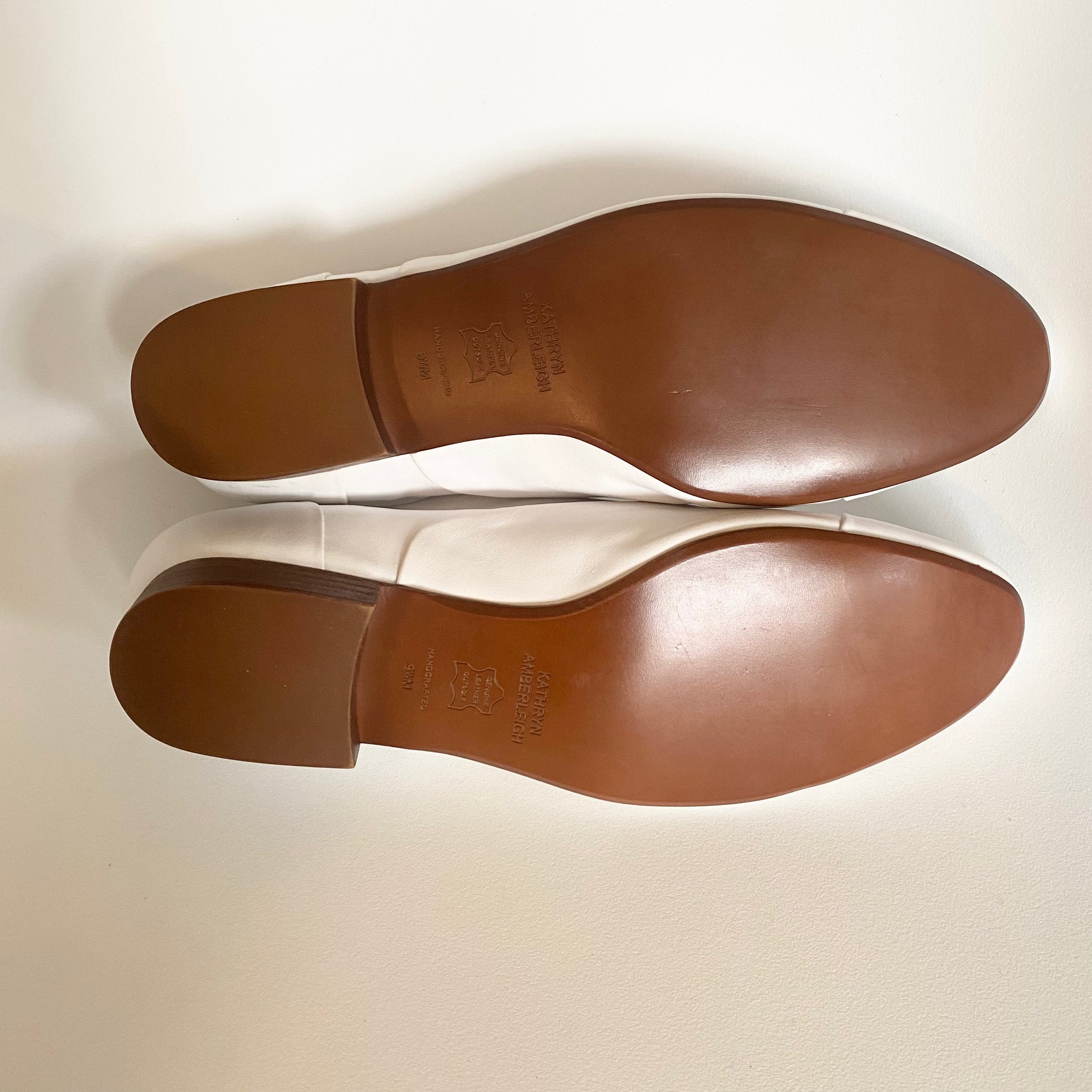 J544 leather loafers; white