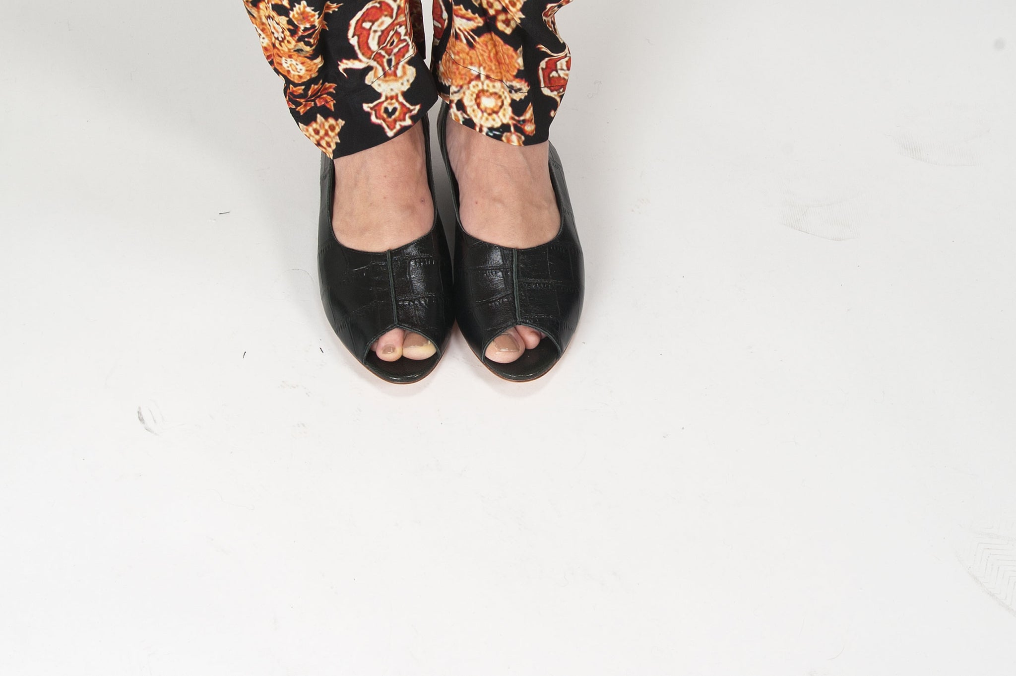K414 leather slingbacks; black croc