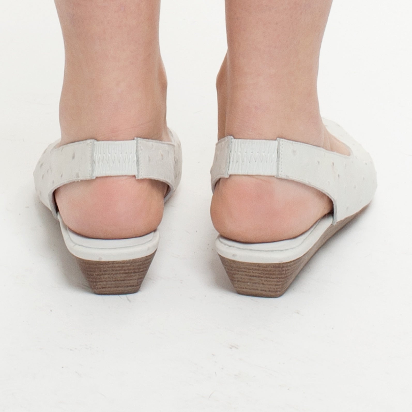 K414 leather slingbacks; white ostrich
